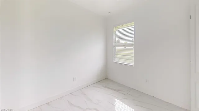 a kitchen with stainless steel appliances a refrigerator sink and cabinets