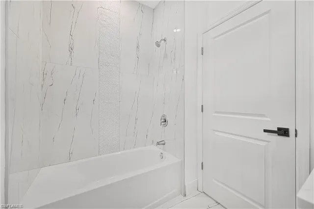 a bathroom with a double vanity sink and mirror