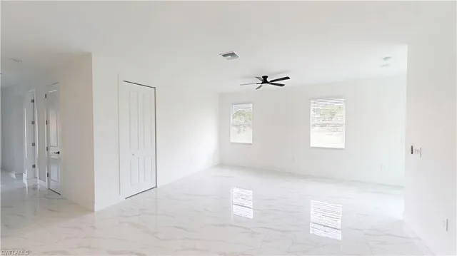 a view of an empty room and window