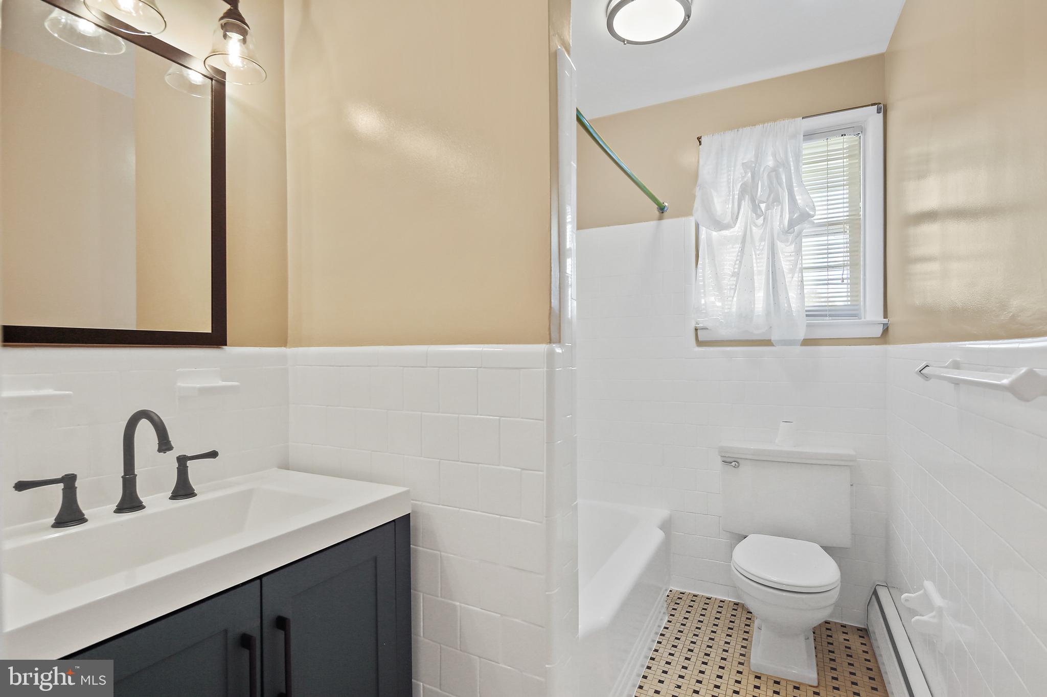 2001 Clifden Road Catonsville, MD 21228 - Photo 23 of 29 Hall bathroom with new vanity and lighting