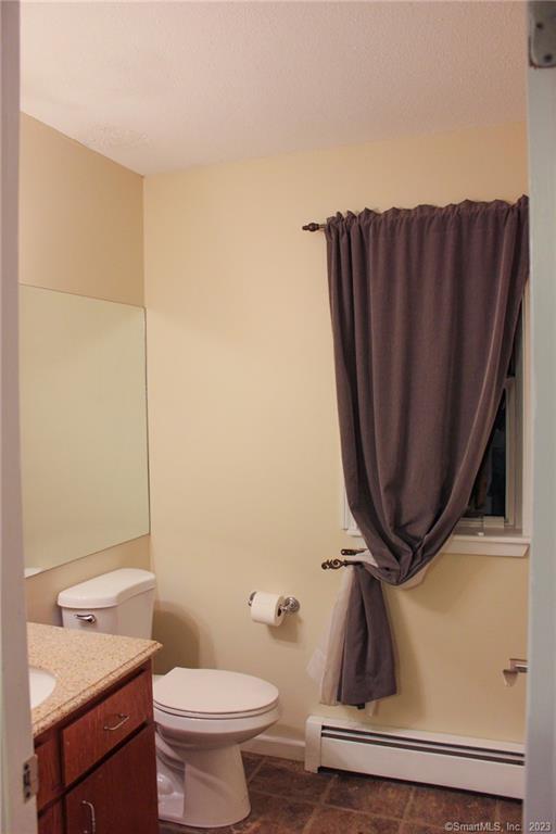 60 Old Town Road, Unit 171 Vernon, CT 06066 - Photo 13 of 30 a bathroom with a toilet and a sink