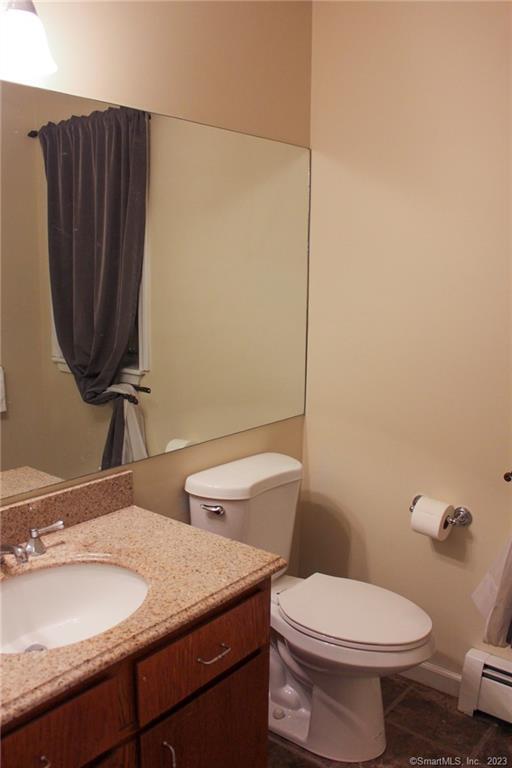 60 Old Town Road, Unit 171 Vernon, CT 06066 - Photo 14 of 30 a bathroom with a granite countertop toilet sink and mirror