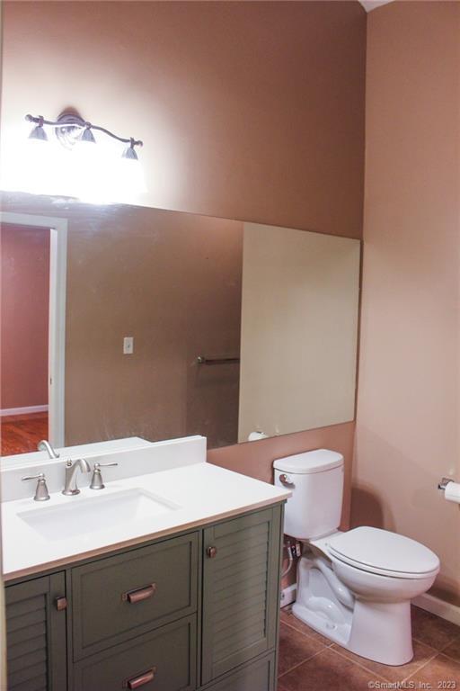 60 Old Town Road, Unit 171 Vernon, CT 06066 - Photo 19 of 30 a bathroom with a toilet a sink and mirror