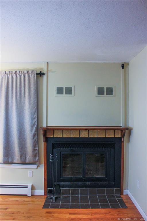60 Old Town Road, Unit 171 Vernon, CT 06066 - Photo 3 of 30 a living room with furniture a rug and a fireplace
