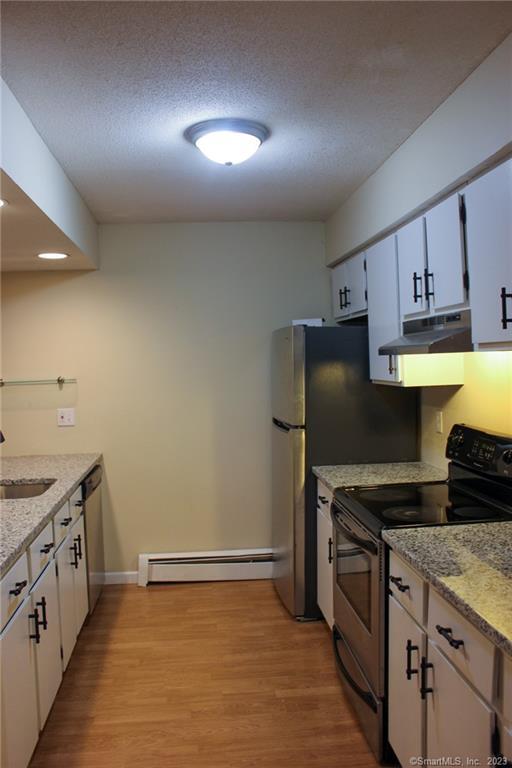 60 Old Town Road, Unit 171 Vernon, CT 06066 - Photo 7 of 30 a kitchen with a sink appliances and cabinets