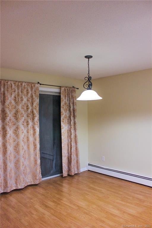 60 Old Town Road, Unit 171 Vernon, CT 06066 - Photo 9 of 30 a view of an empty room with wooden floor and a window