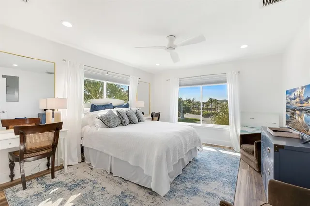 a bedroom with a large bed and a window