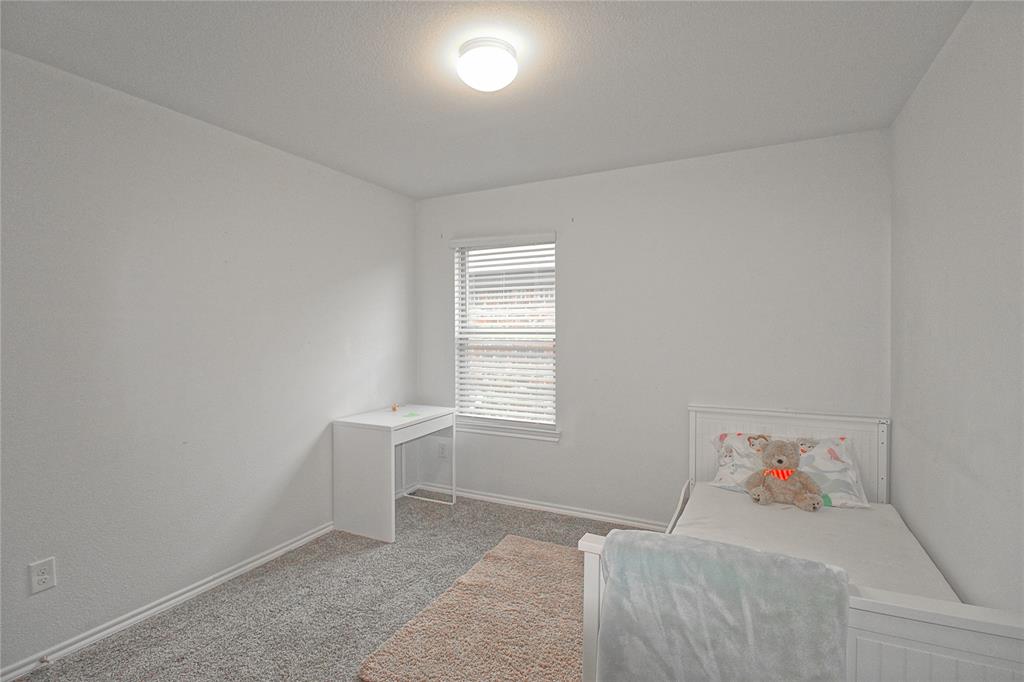 2428 Rosharon Drive Forney, TX 75126 - Photo 15 of 34 a room with a bed and a window