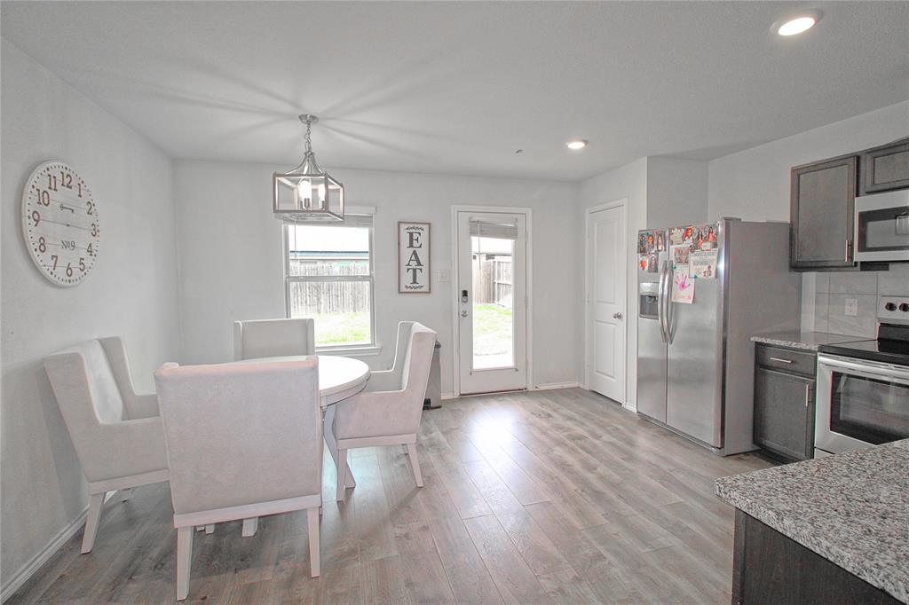 2428 Rosharon Drive Forney, TX 75126 - Photo 19 of 34 a view of a kitchen and dining room