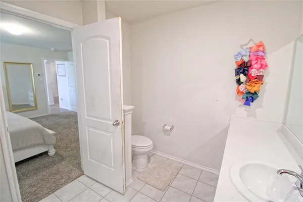 a bathroom with a sink toilet and vanity