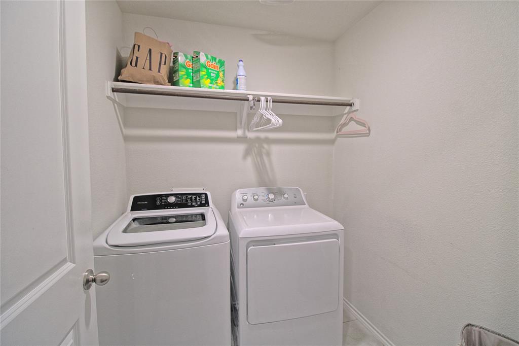 2428 Rosharon Drive Forney, TX 75126 - Photo 30 of 34 a room with storage and utility