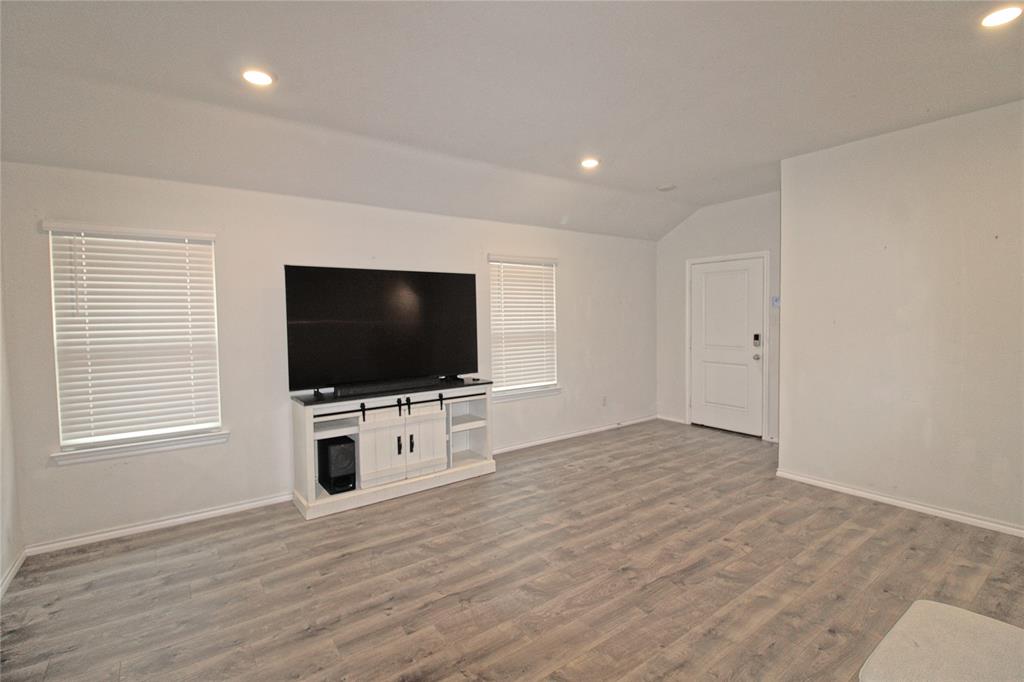 2428 Rosharon Drive Forney, TX 75126 - Photo 5 of 34 a living room with flat screen tv and a window