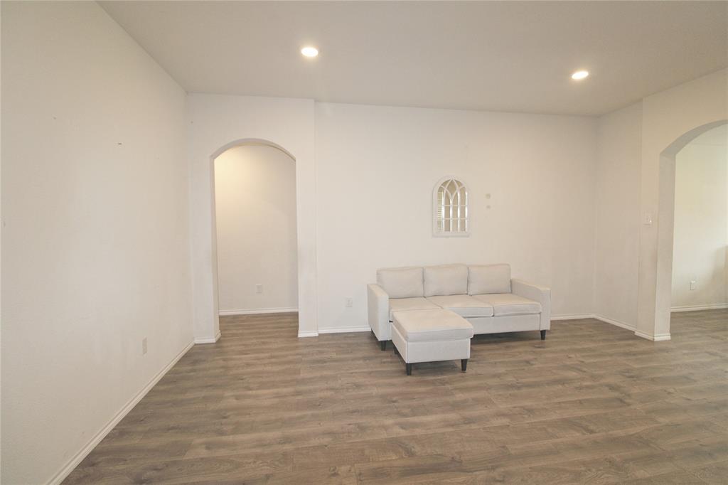 2428 Rosharon Drive Forney, TX 75126 - Photo 6 of 34 a living room with furniture and a wooden floor