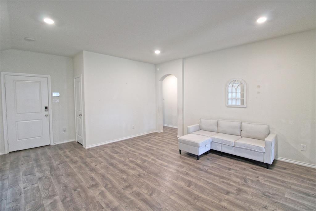 2428 Rosharon Drive Forney, TX 75126 - Photo 7 of 34 a living room with furniture and a wooden floor