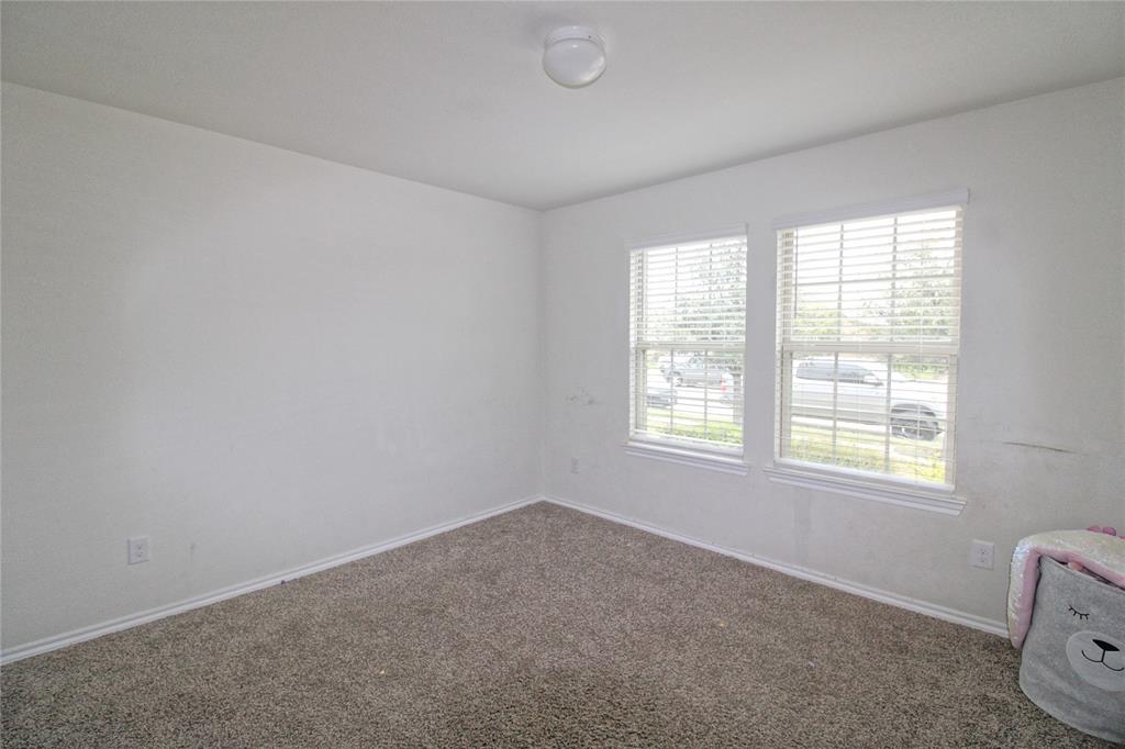 2428 Rosharon Drive Forney, TX 75126 - Photo 9 of 34 an empty room with windows