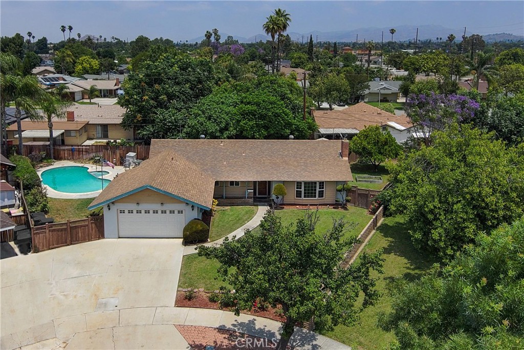 8928 Christopher Place Riverside, CA 92503 - Photo 1 of 1 an aerial view of a house with a yard and lake view