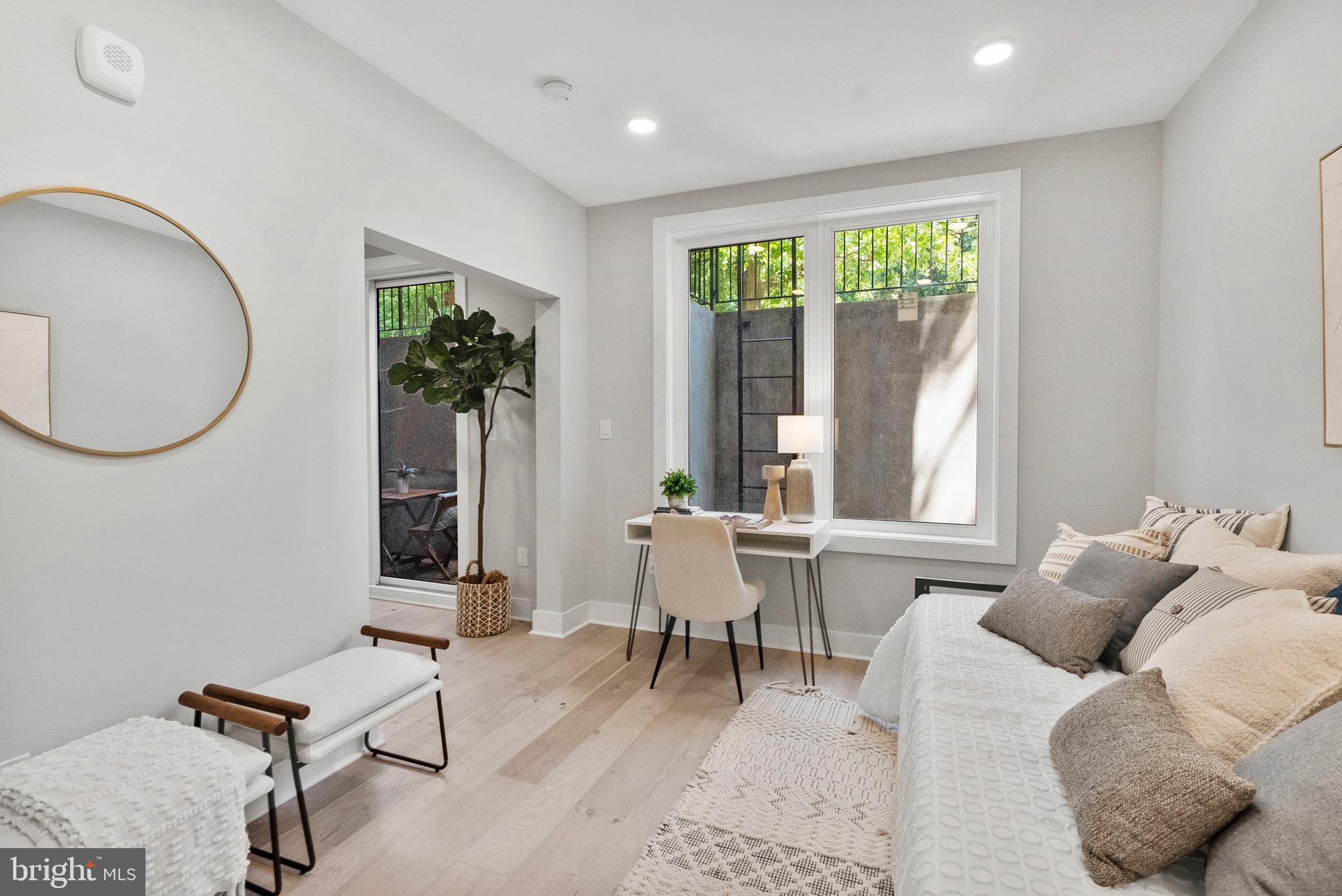 2019 M Street Northeast, Unit 1 Washington, DC 20002 - Photo 12 of 31 a living room with furniture and a window