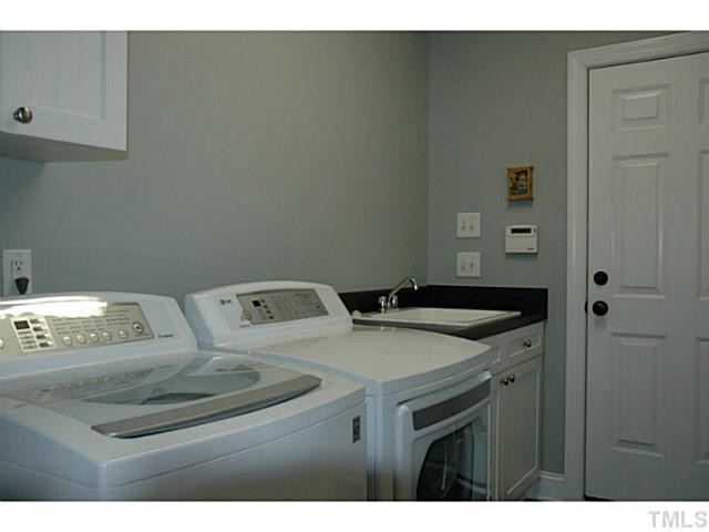 9312 Tabriz Point Raleigh, NC 27614 - Photo 21 of 25 Utility room/mudroom off of garage.