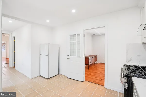 a view of a kitchen cabinets and wooden floor