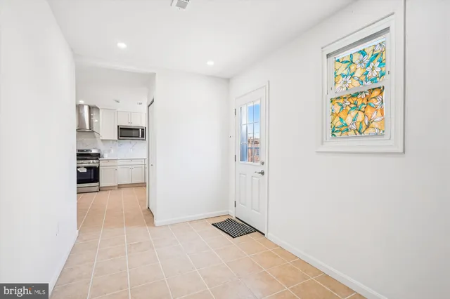 a view of kitchen with furniture and window