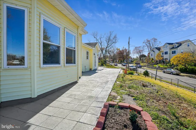 a view of a swimming pool with sitting area