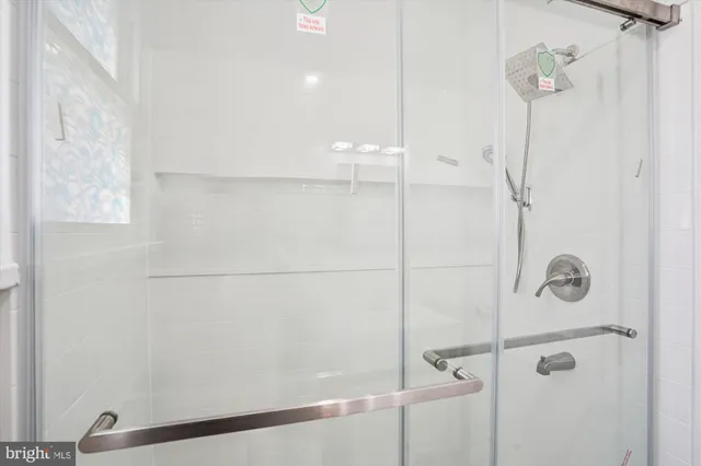 a bathroom with a sink mirror vanity and toilet