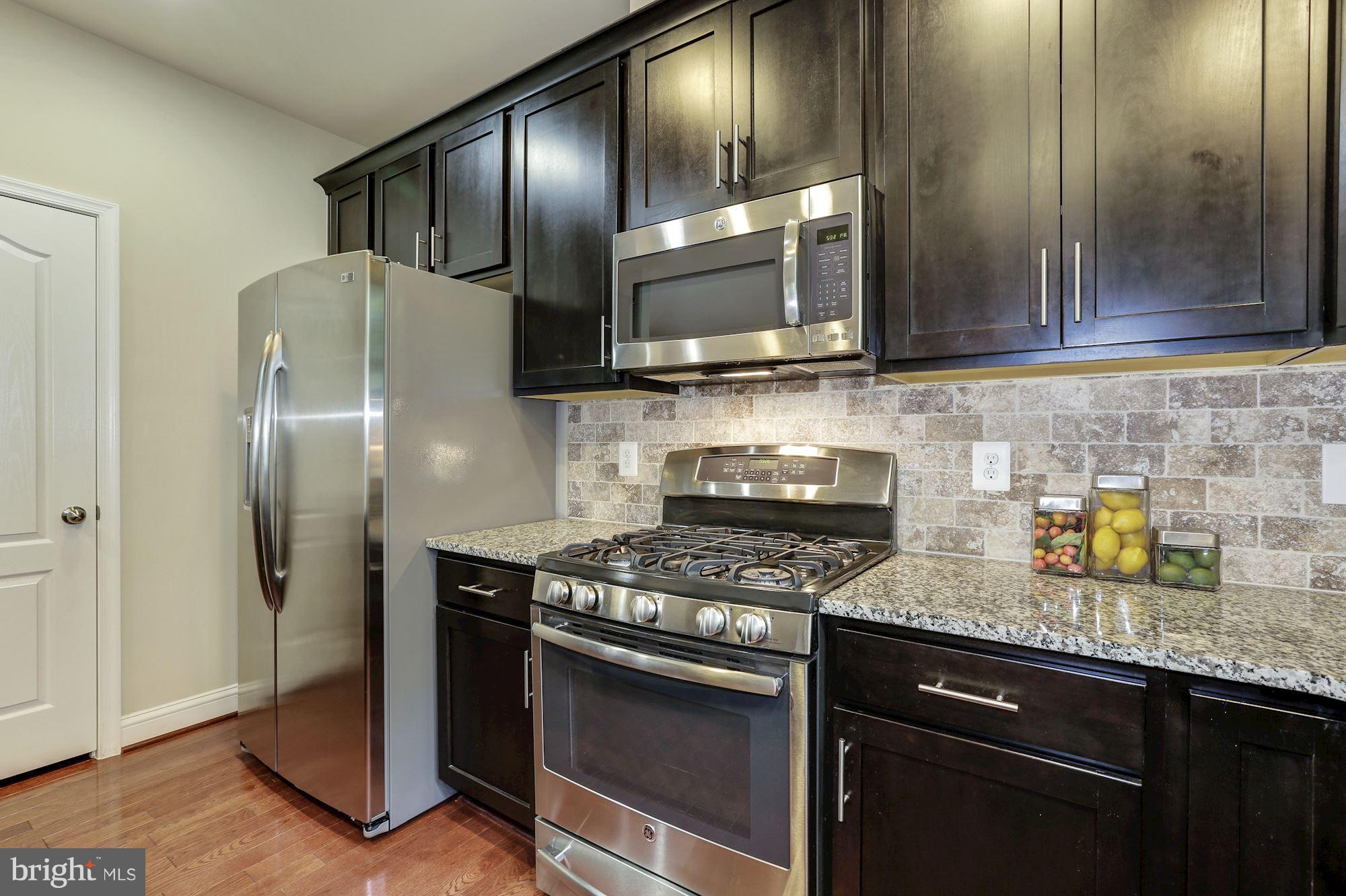 14405 Vedanta Way Silver Spring, MD 20906 - Photo 10 of 30 Beautiful finishes include tile backsplash