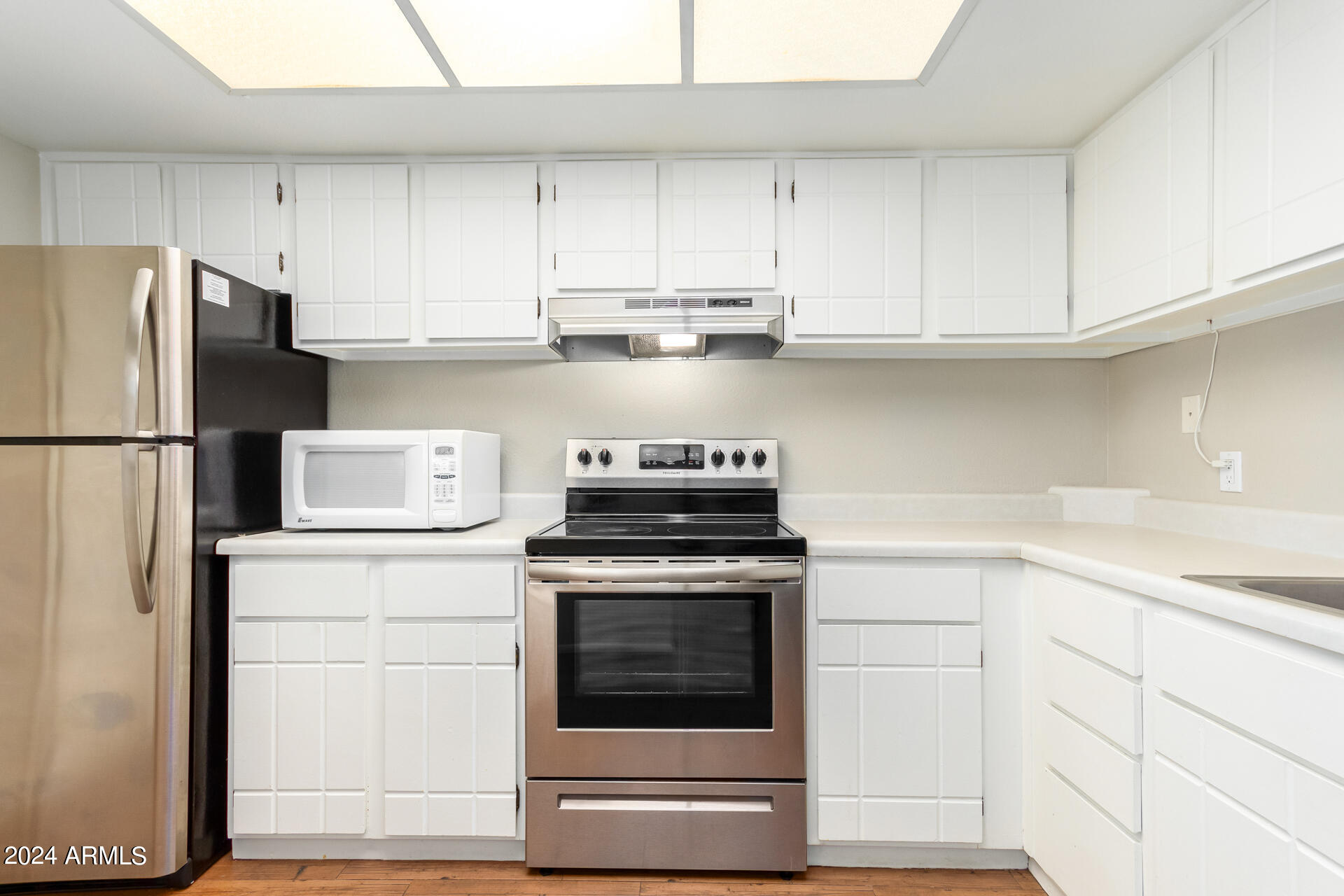 4201 East Camelback Road, Unit 35 Phoenix, AZ 85018 - Photo 1 of 33 a kitchen with cabinets and appliances
