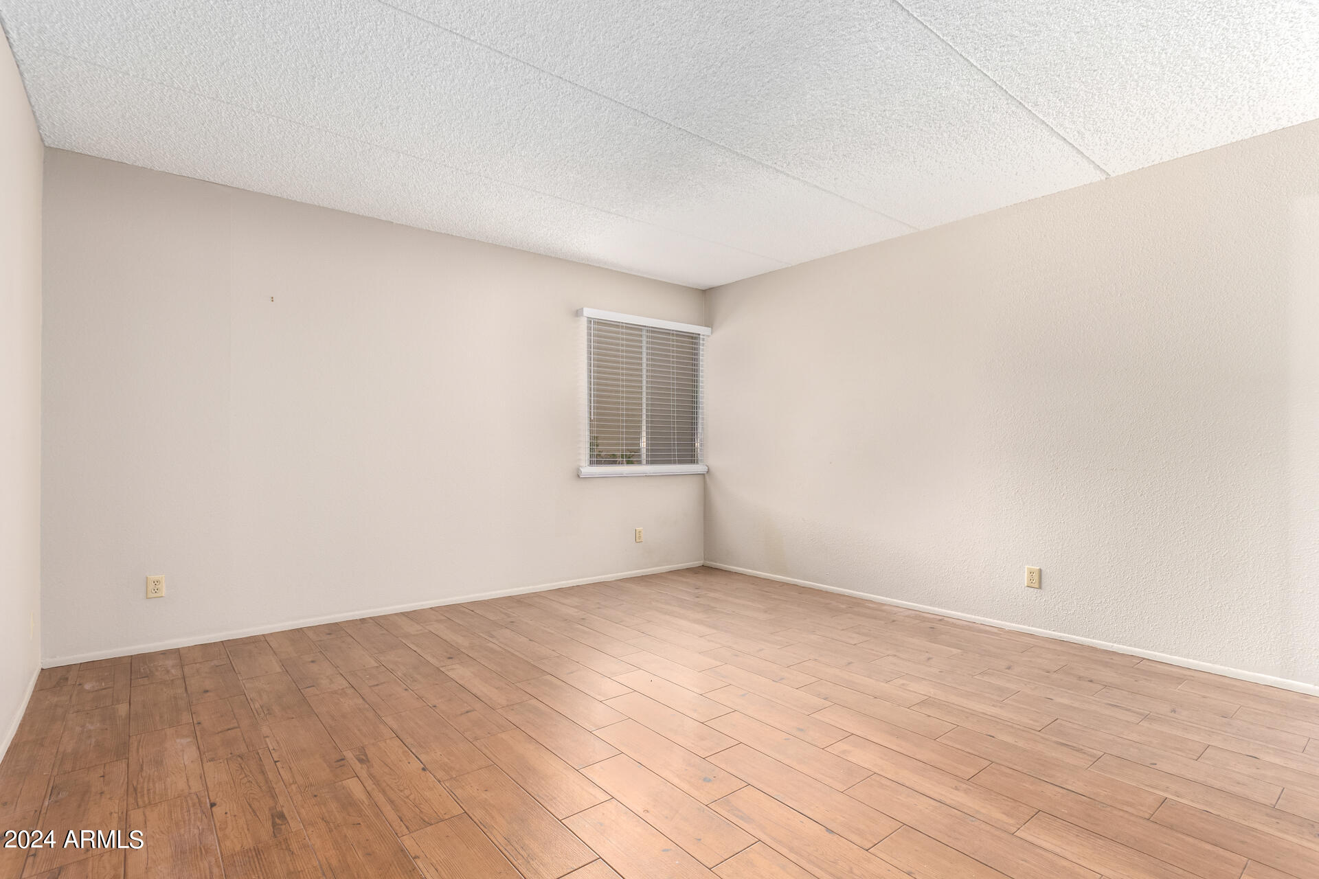 4201 East Camelback Road, Unit 35 Phoenix, AZ 85018 - Photo 19 of 33 wooden floor in a room