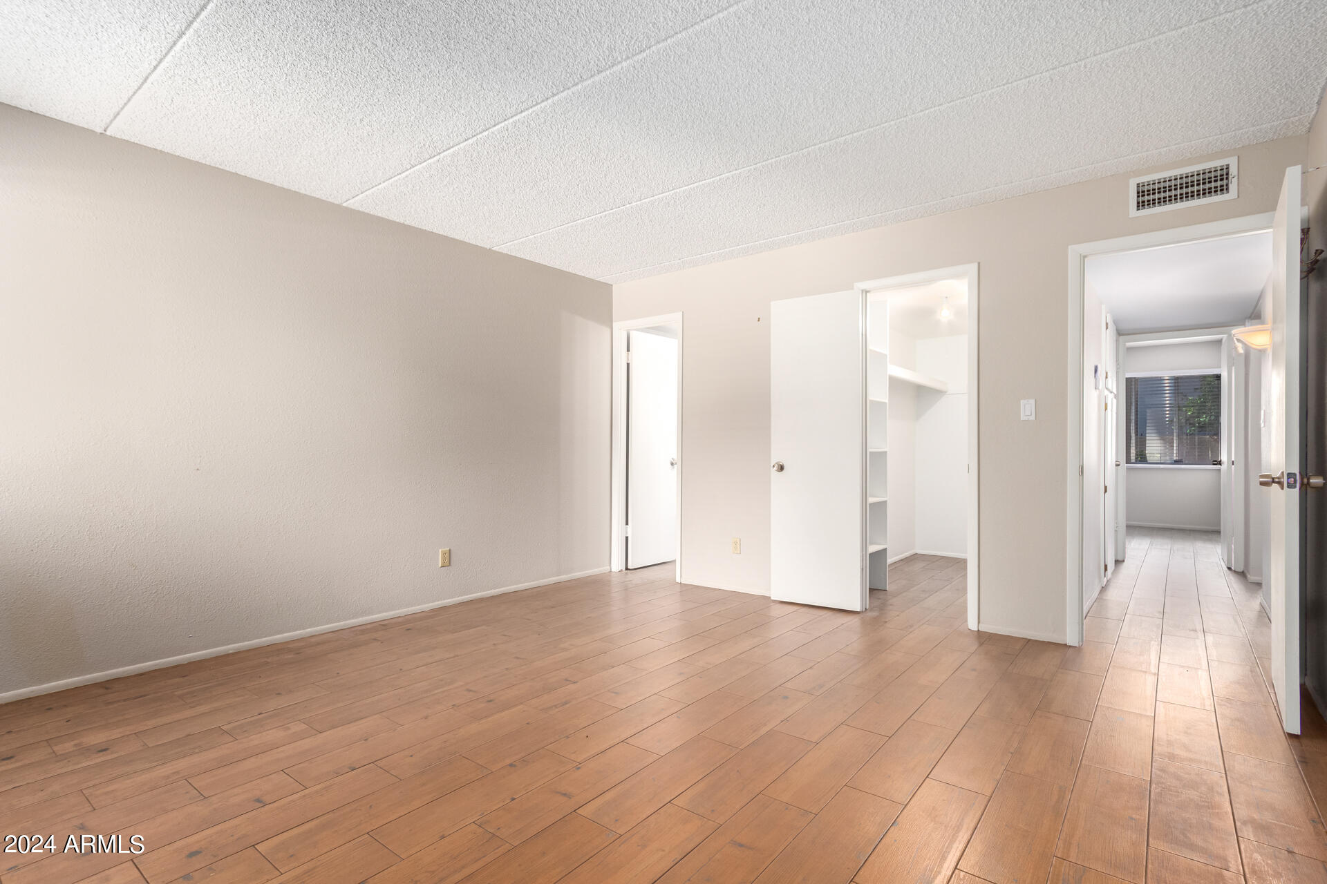 4201 East Camelback Road, Unit 35 Phoenix, AZ 85018 - Photo 20 of 33 a view of a room with wooden floor