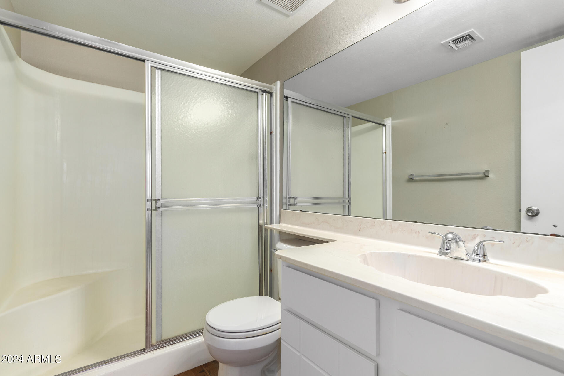 4201 East Camelback Road, Unit 35 Phoenix, AZ 85018 - Photo 22 of 33 a bathroom with a sink toilet and shower