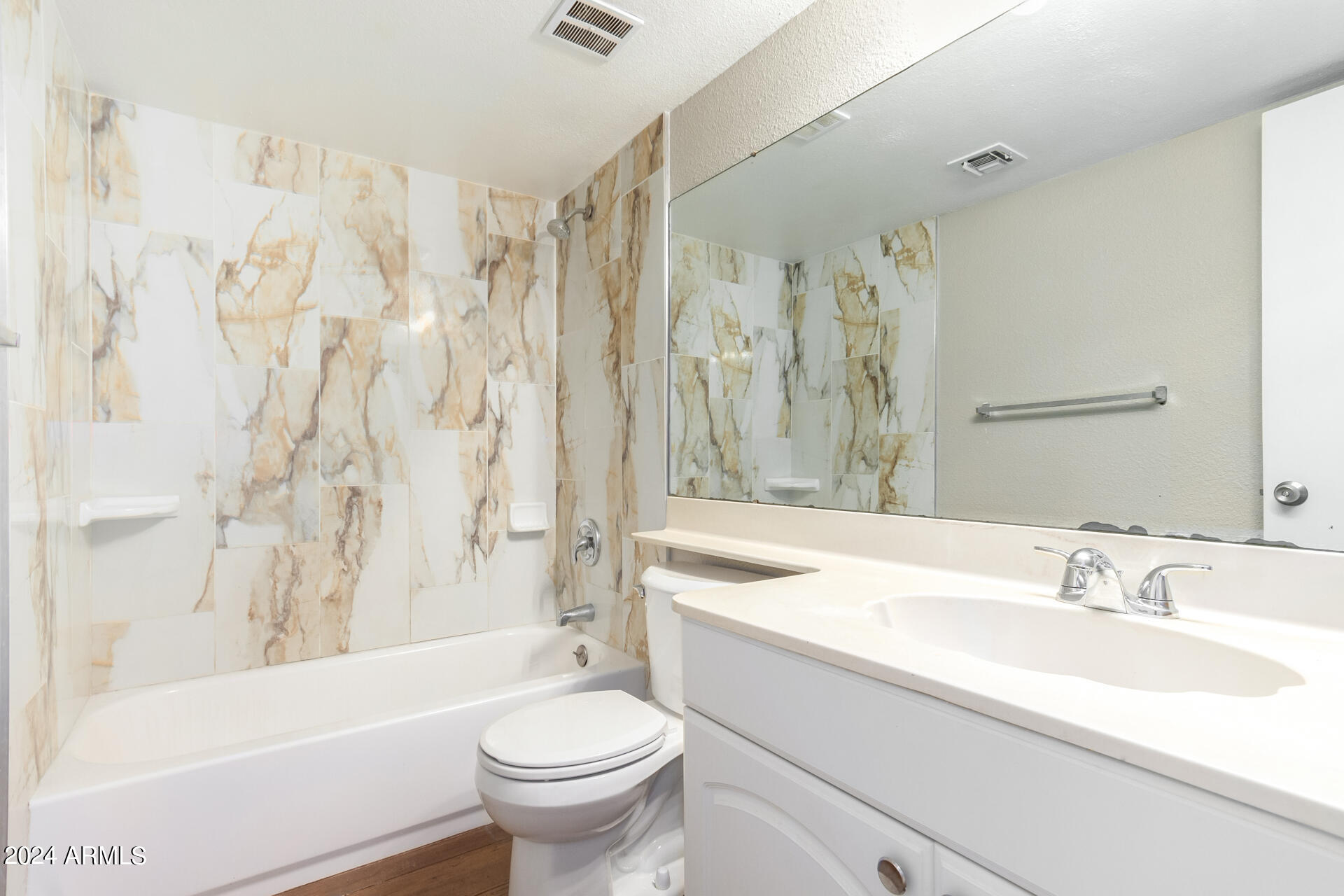 4201 East Camelback Road, Unit 35 Phoenix, AZ 85018 - Photo 27 of 33 a bathroom with a sink toilet and shower