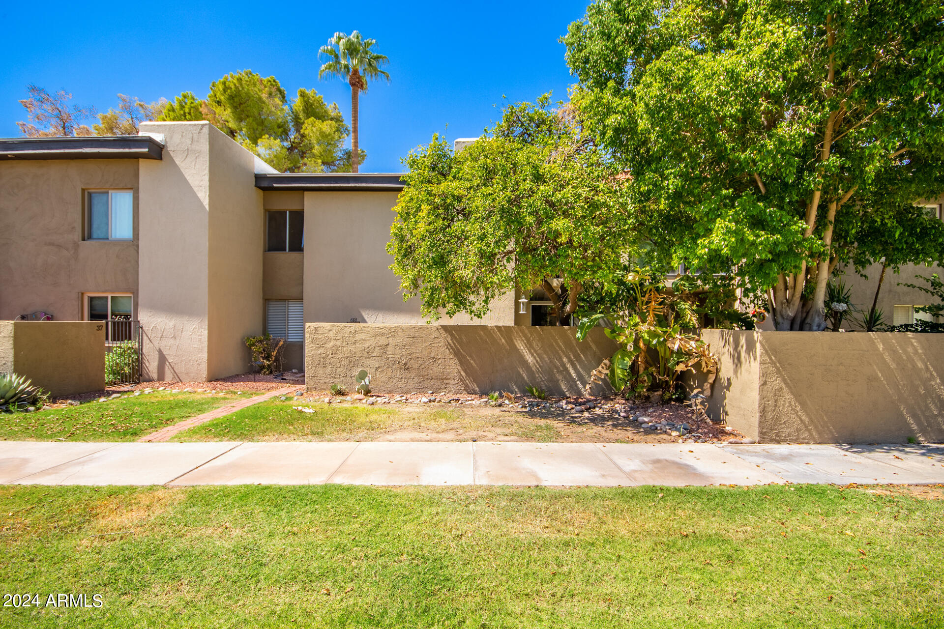 4201 East Camelback Road, Unit 35 Phoenix, AZ 85018 - Photo 33 of 33 a view of a house with a yard