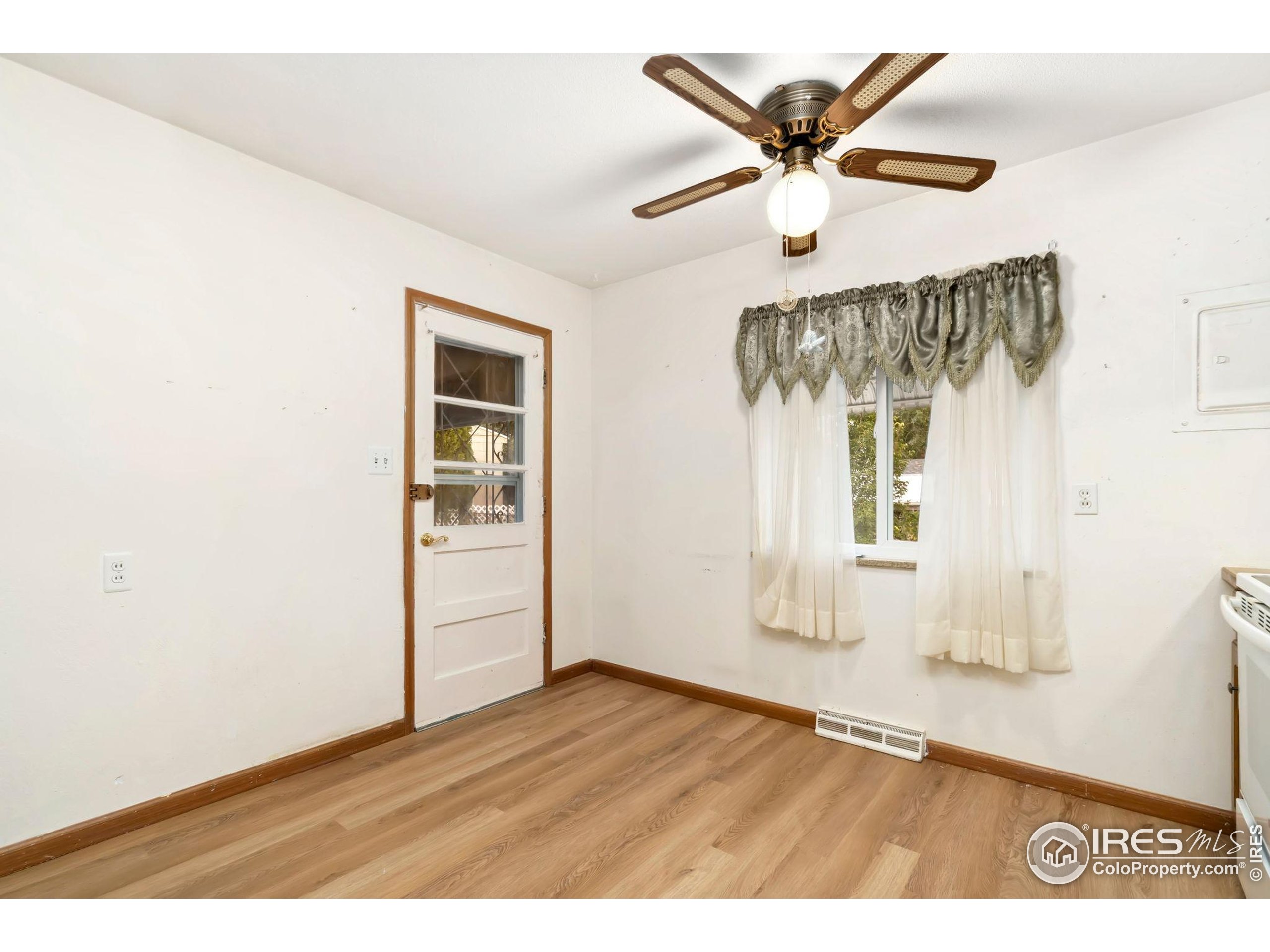 2046 26th Street Road Greeley, CO 80631 - Photo 13 of 34 a view of an empty room with a window