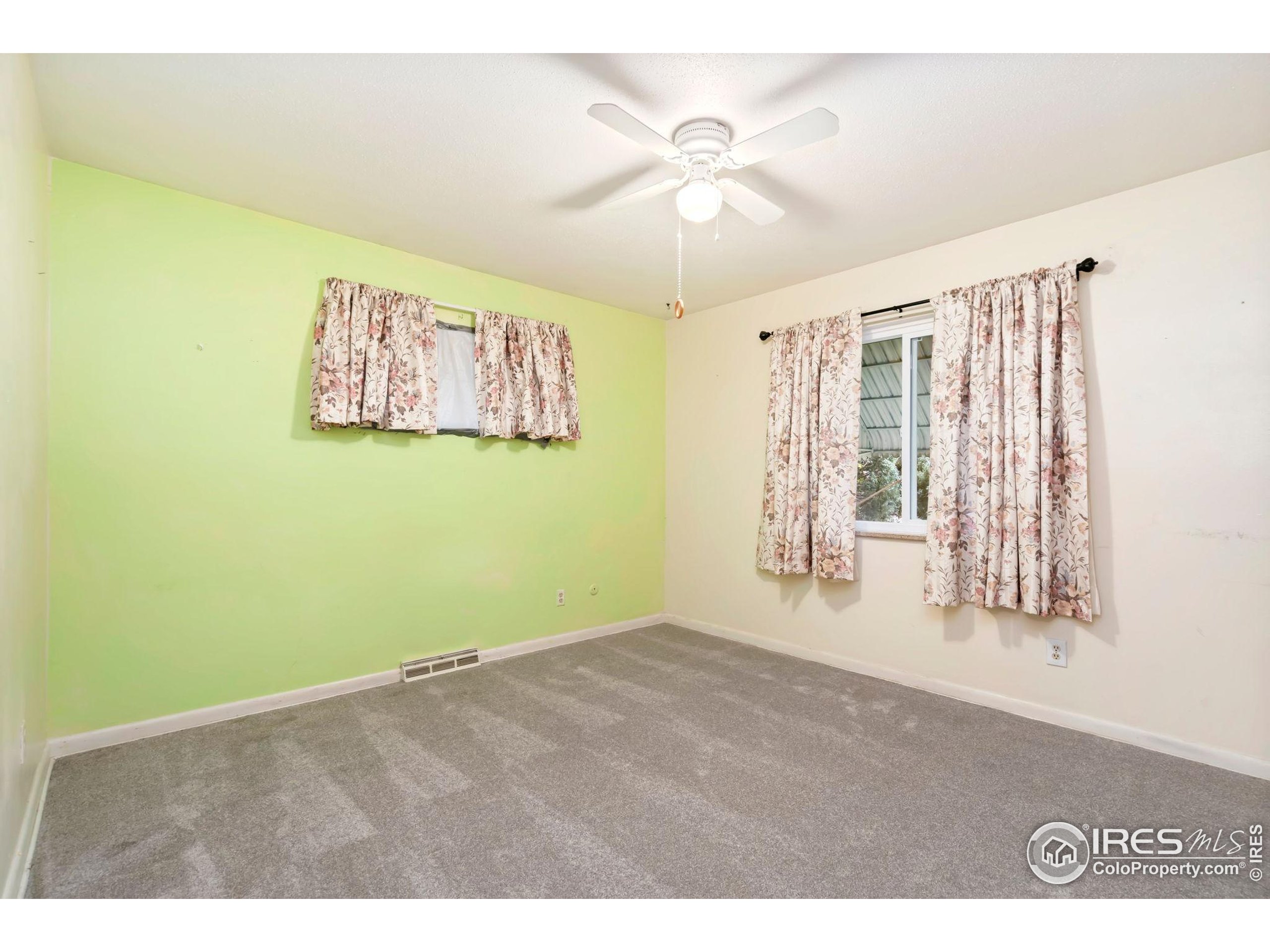 2046 26th Street Road Greeley, CO 80631 - Photo 19 of 34 a view of an empty room with a window
