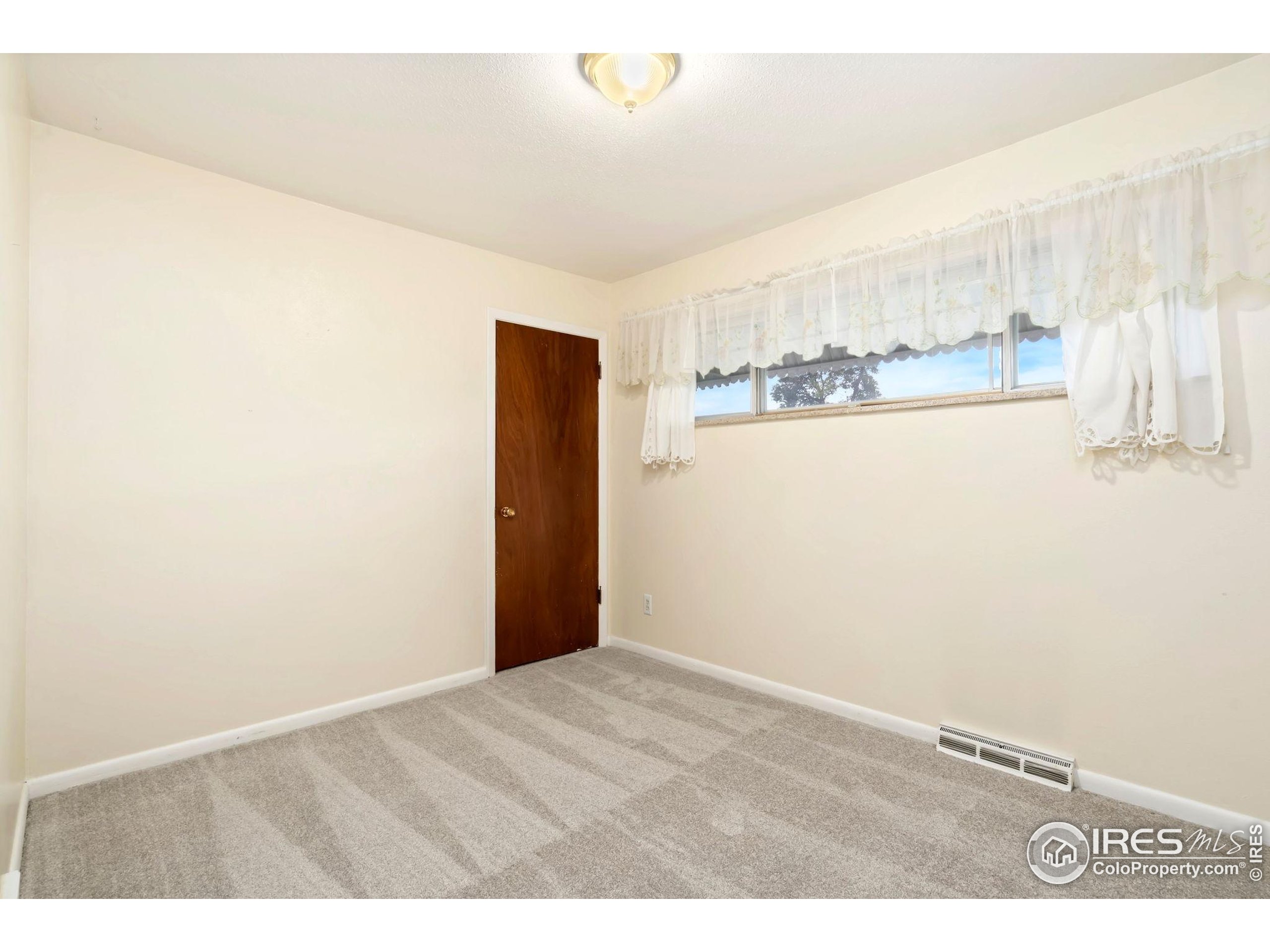 2046 26th Street Road Greeley, CO 80631 - Photo 21 of 34 a view of an empty room