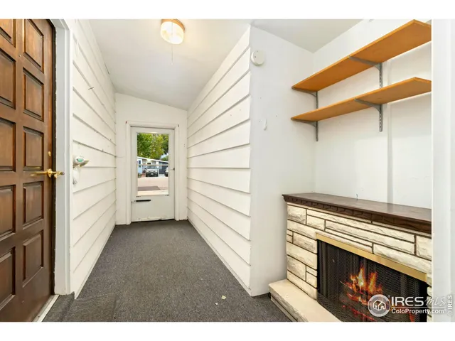 a view of a livingroom with furniture and staircase