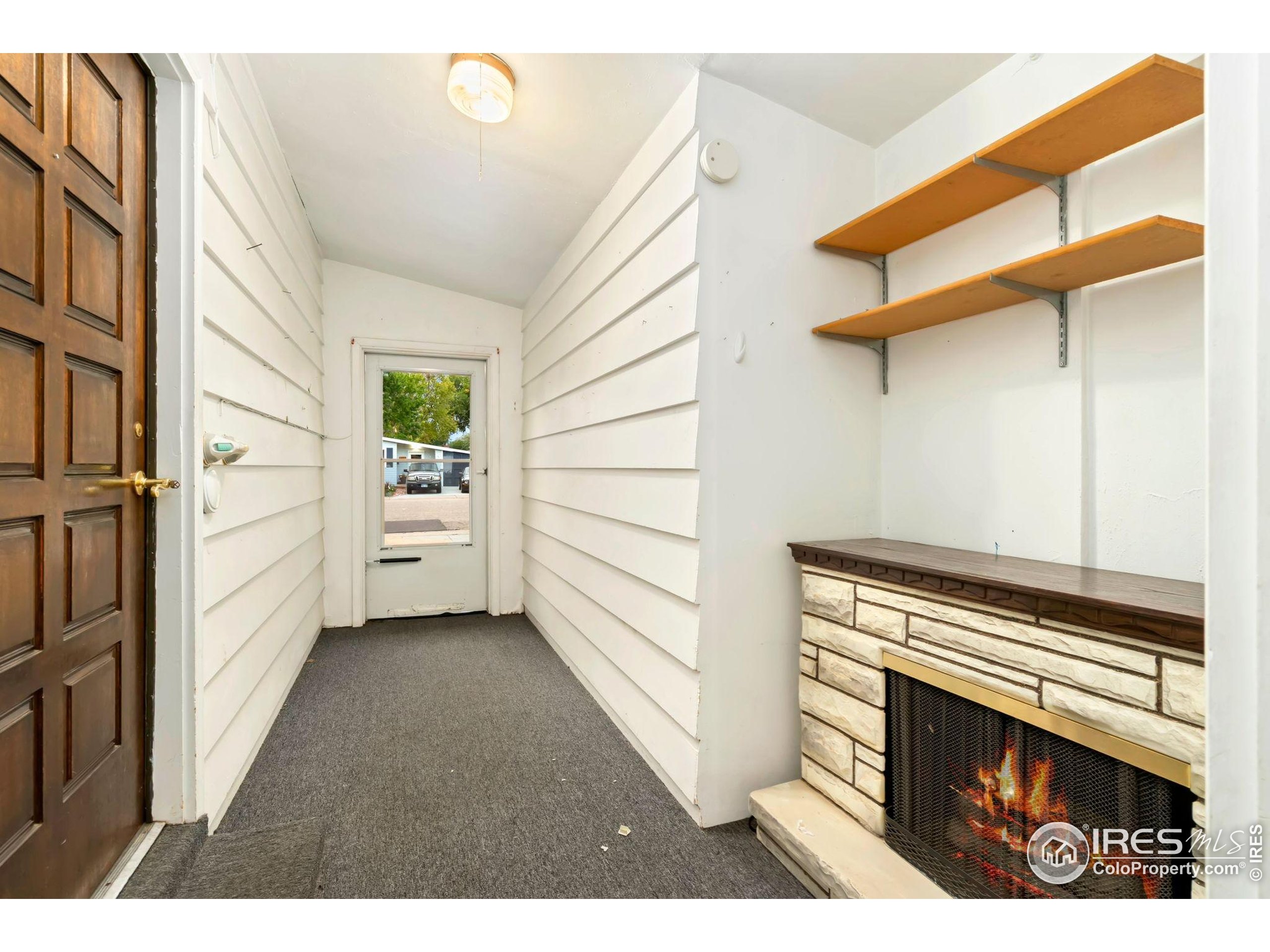 2046 26th Street Road Greeley, CO 80631 - Photo 23 of 34 a view of a livingroom with furniture and staircase