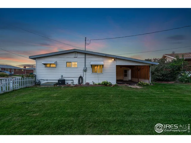 a view of a backyard with plants and a garden