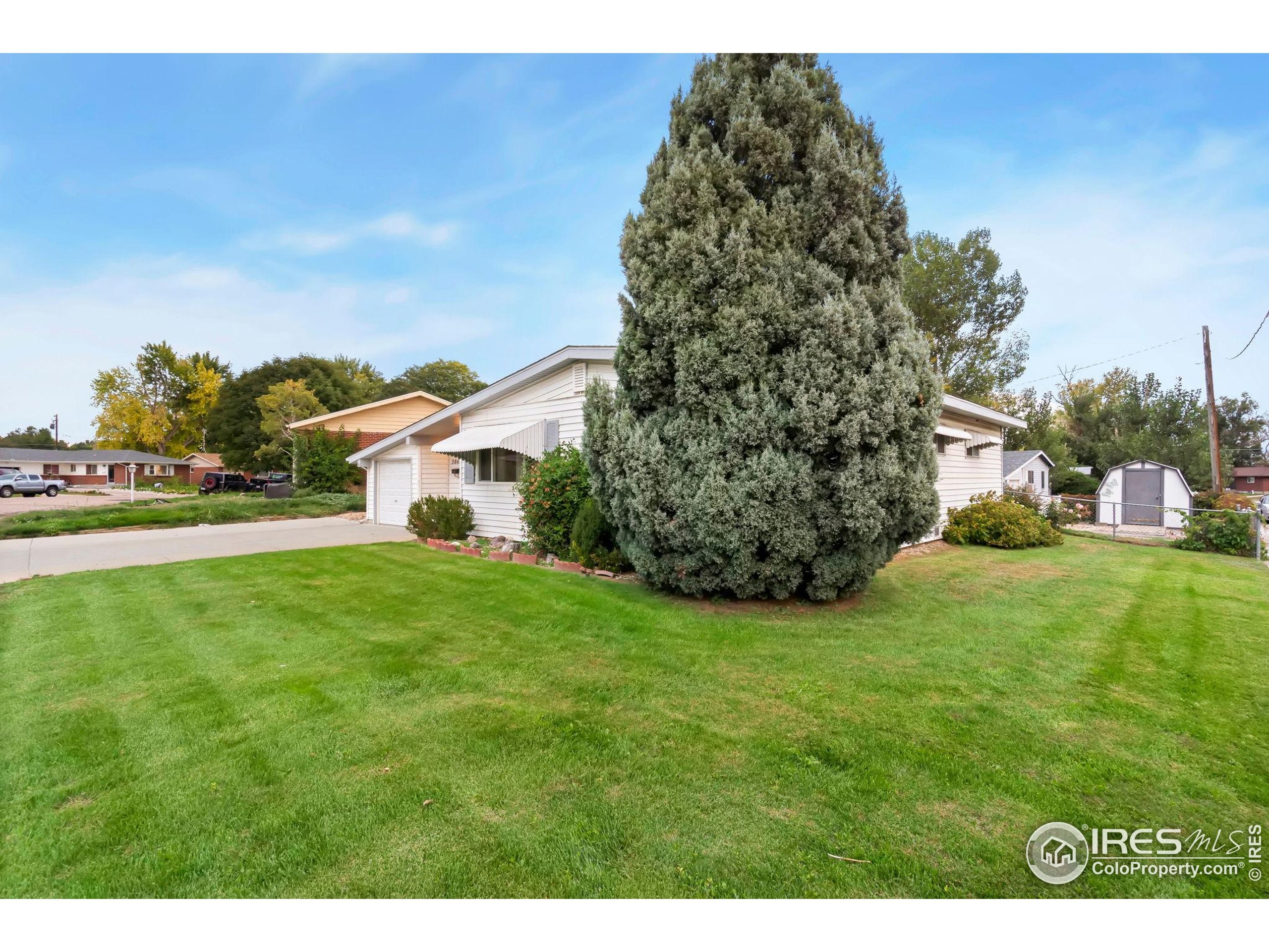 2046 26th Street Road Greeley, CO 80631 - Photo 6 of 34 a view of a field of grass and trees