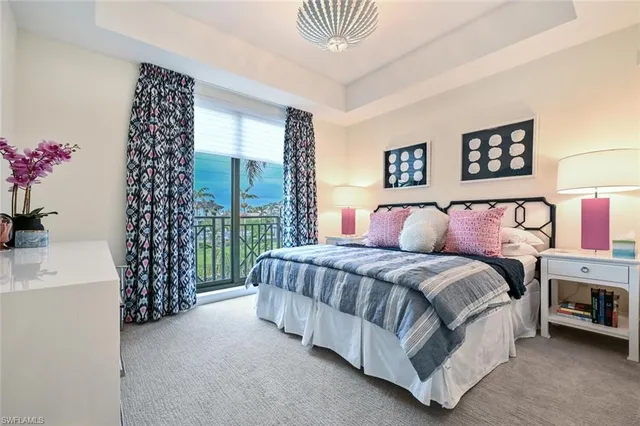 a bed room with a bed and a chair