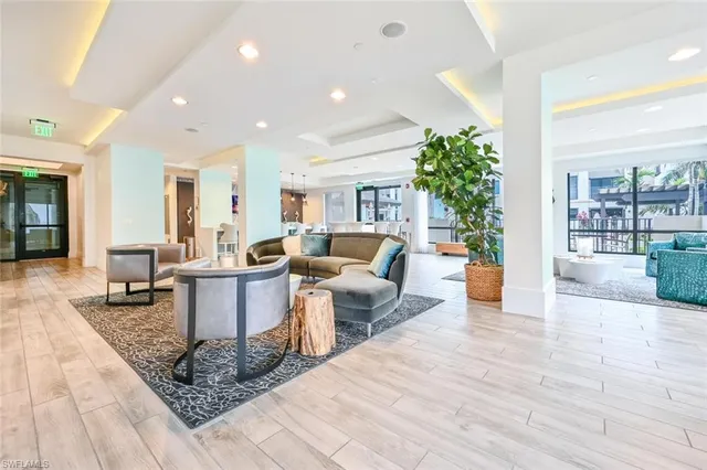 a living room with furniture and a rug