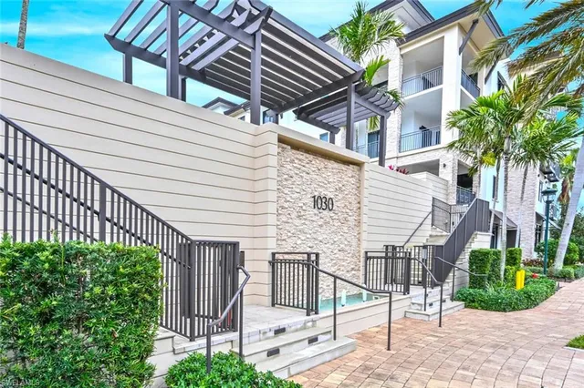 a view of a house with a iron stairs