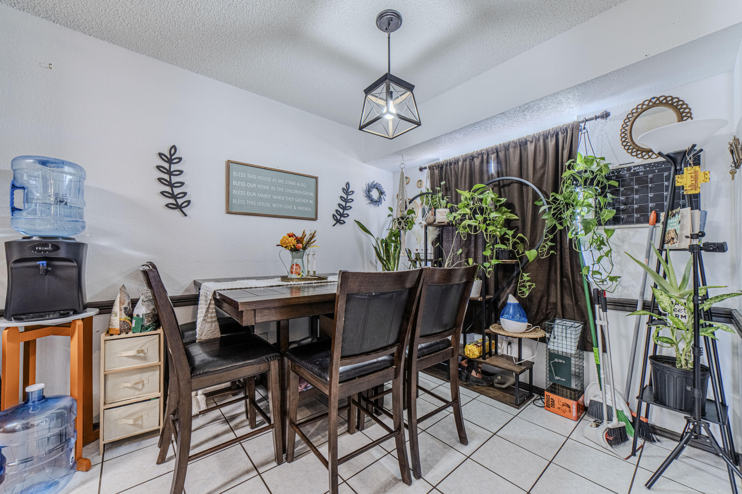 6015 14th Street Lubbock, TX 79416 - Photo 11 of 24 a view of a dining room with furniture window and flowerpot
