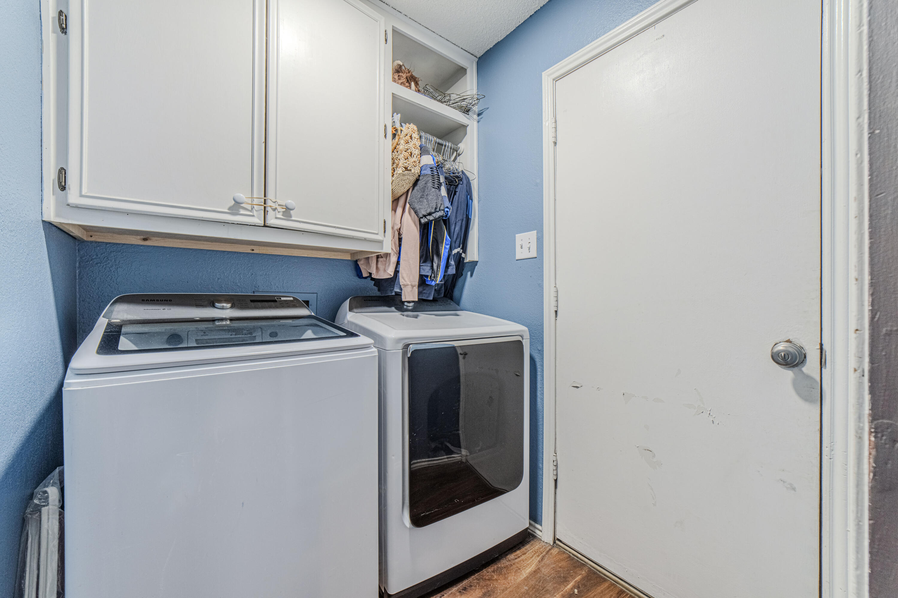 6015 14th Street Lubbock, TX 79416 - Photo 18 of 24 a view of storage and utility room with washer and dryer