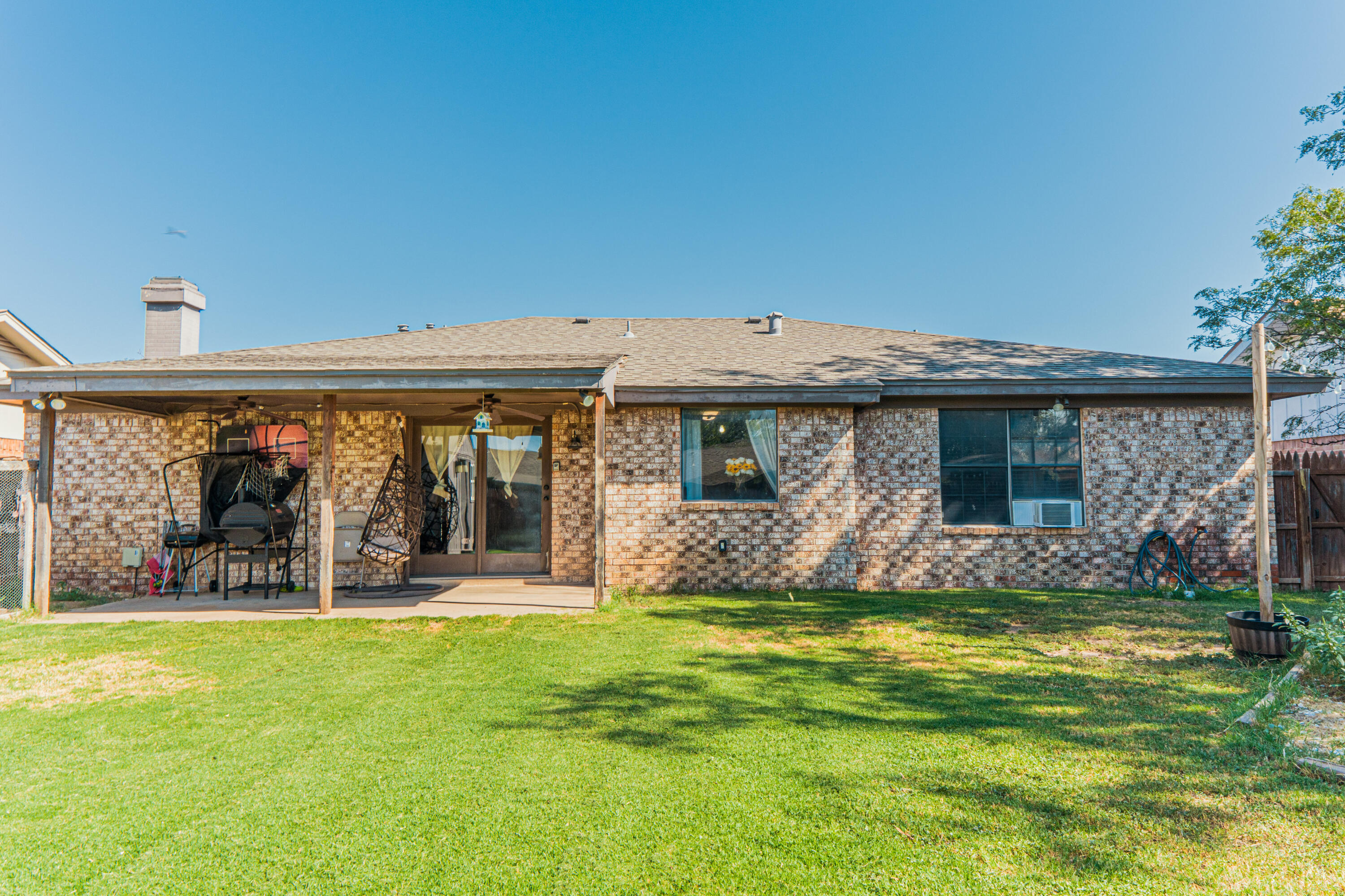 6015 14th Street Lubbock, TX 79416 - Photo 19 of 24 a view of a house with swimming pool and garden