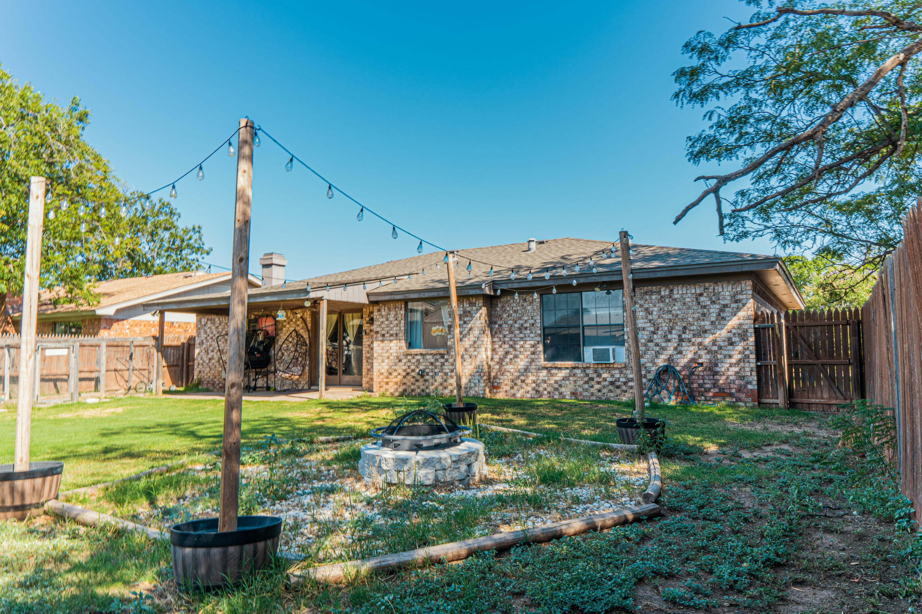 6015 14th Street Lubbock, TX 79416 - Photo 20 of 24 a front view of a house with garden