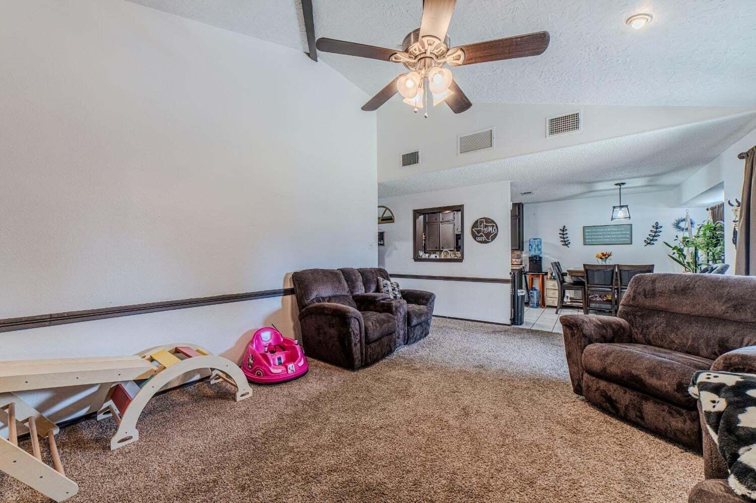 6015 14th Street Lubbock, TX 79416 - Photo 7 of 24 a living room with furniture