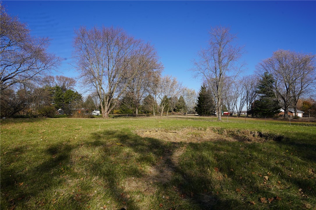 8746 Grubbs-Rex Road Arcanum, OH 45304 - Photo 27 of 38 Expansive green space offers a serene canvas for outdoor enjoyment.