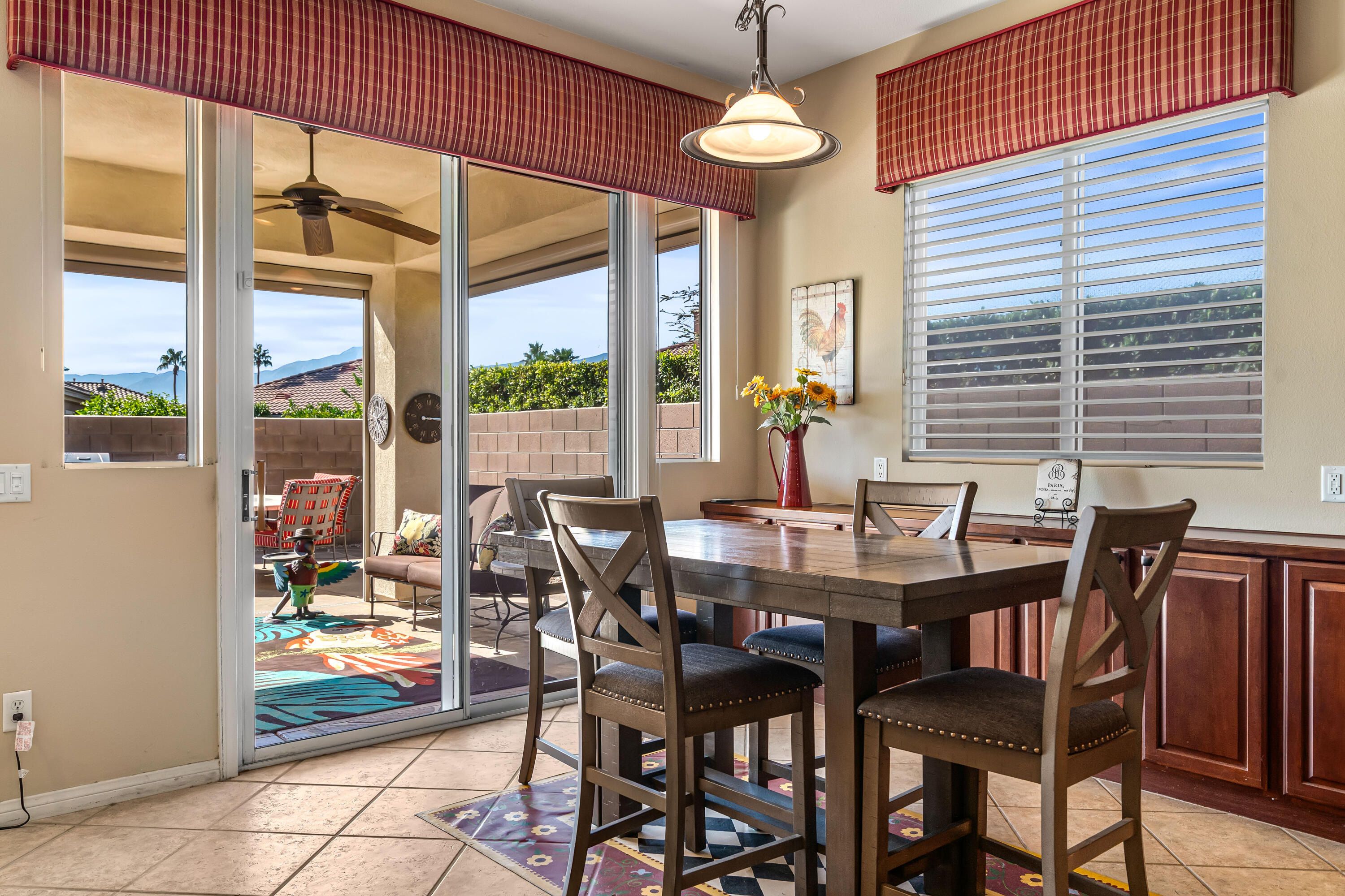 80607 Prestwick Place Indio, CA 92201 - Photo 19 of 68 a view of a dining room with furniture window and outside view